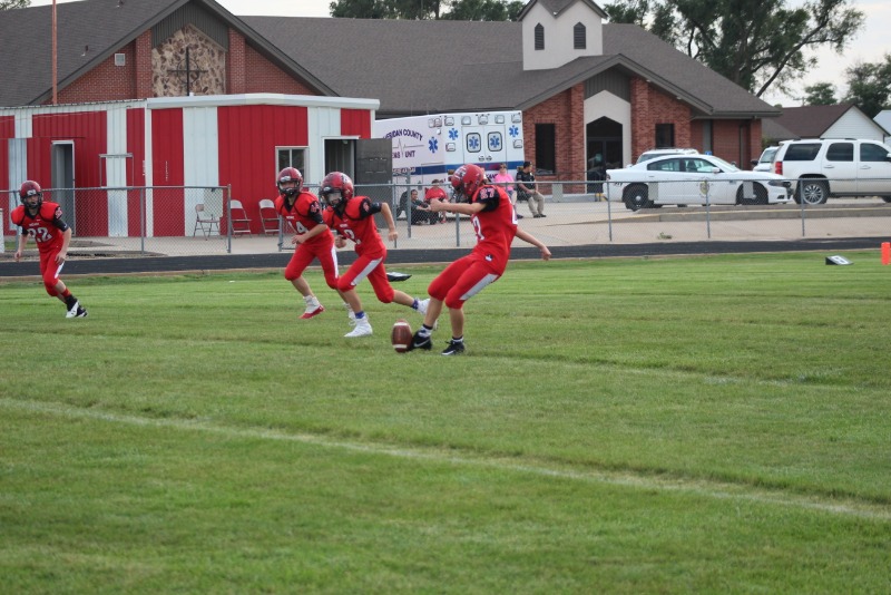 Dayton Bell, Tate Weimer and Macon Sekavec ready themselves to defend the kickoff as Hanna Schell kicks off at the JV football game.